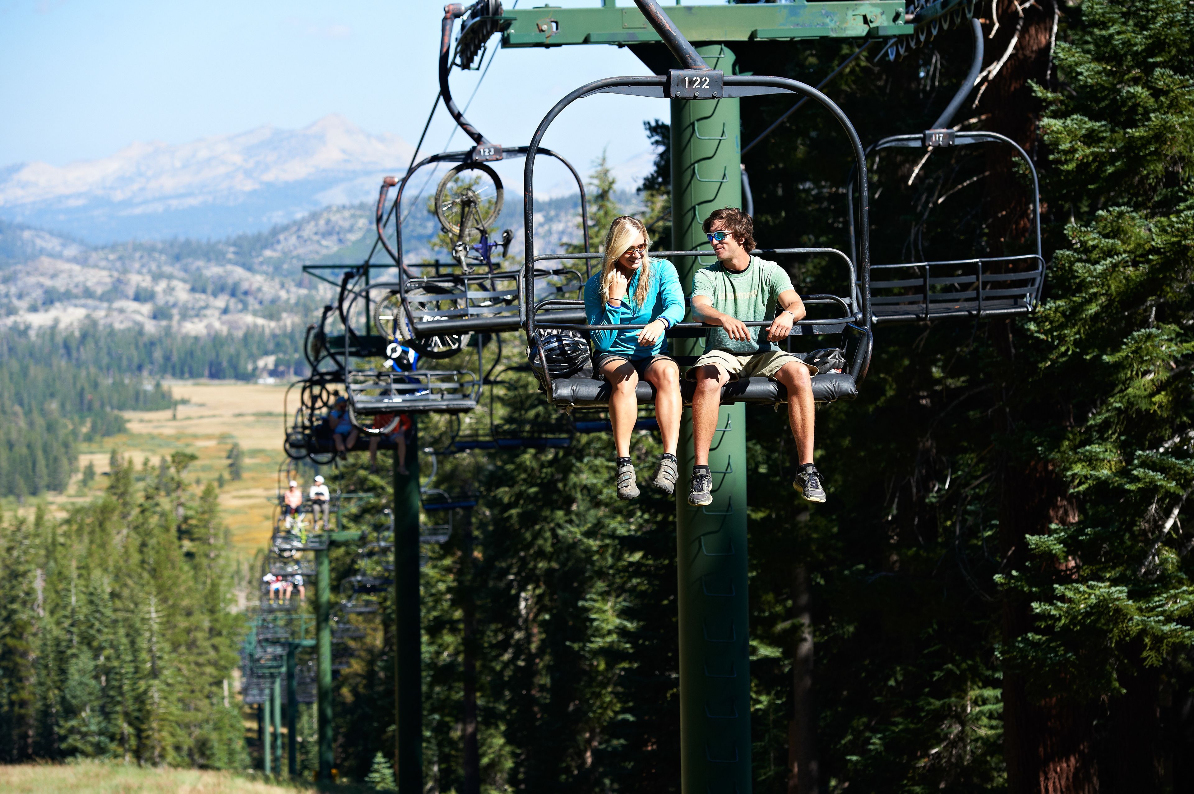 A ski lift with passengers.