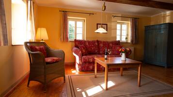 Comfort Duplex, Non Smoking, Corner | Living area | 35-inch flat-screen TV with cable channels, tablet