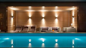 Indoor pool, open 7:00 AM to 10:00 PM, pool loungers