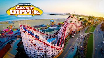 A roller coaster at Santa Cruz Giant Dipper with a coastal backdrop.