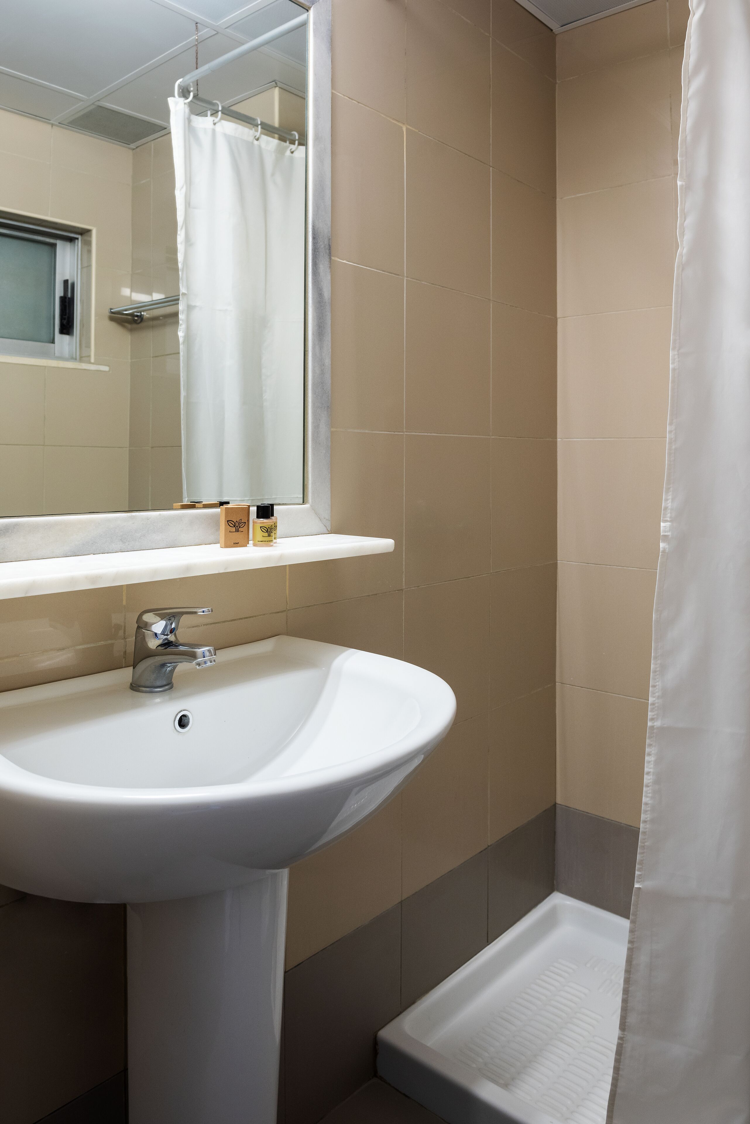 shower, eco-friendly toiletries, hair dryer, towels