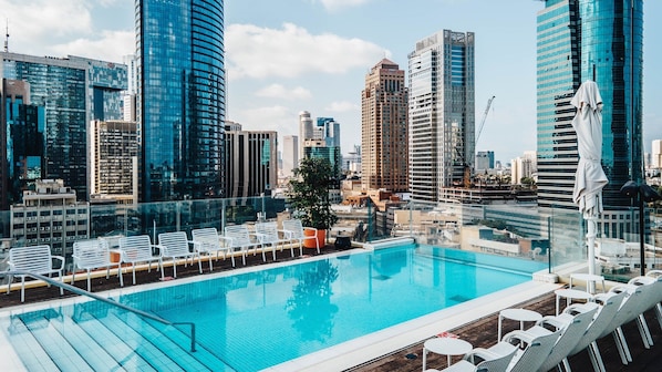 Seasonal outdoor pool, open 10:00 AM to 6 PM, pool umbrellas