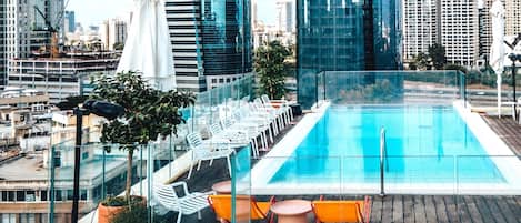 Seasonal outdoor pool, open 10:00 AM to 6 PM, pool umbrellas