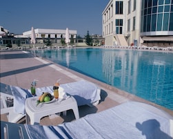 Indoor pool, outdoor pool, pool umbrellas, sun loungers