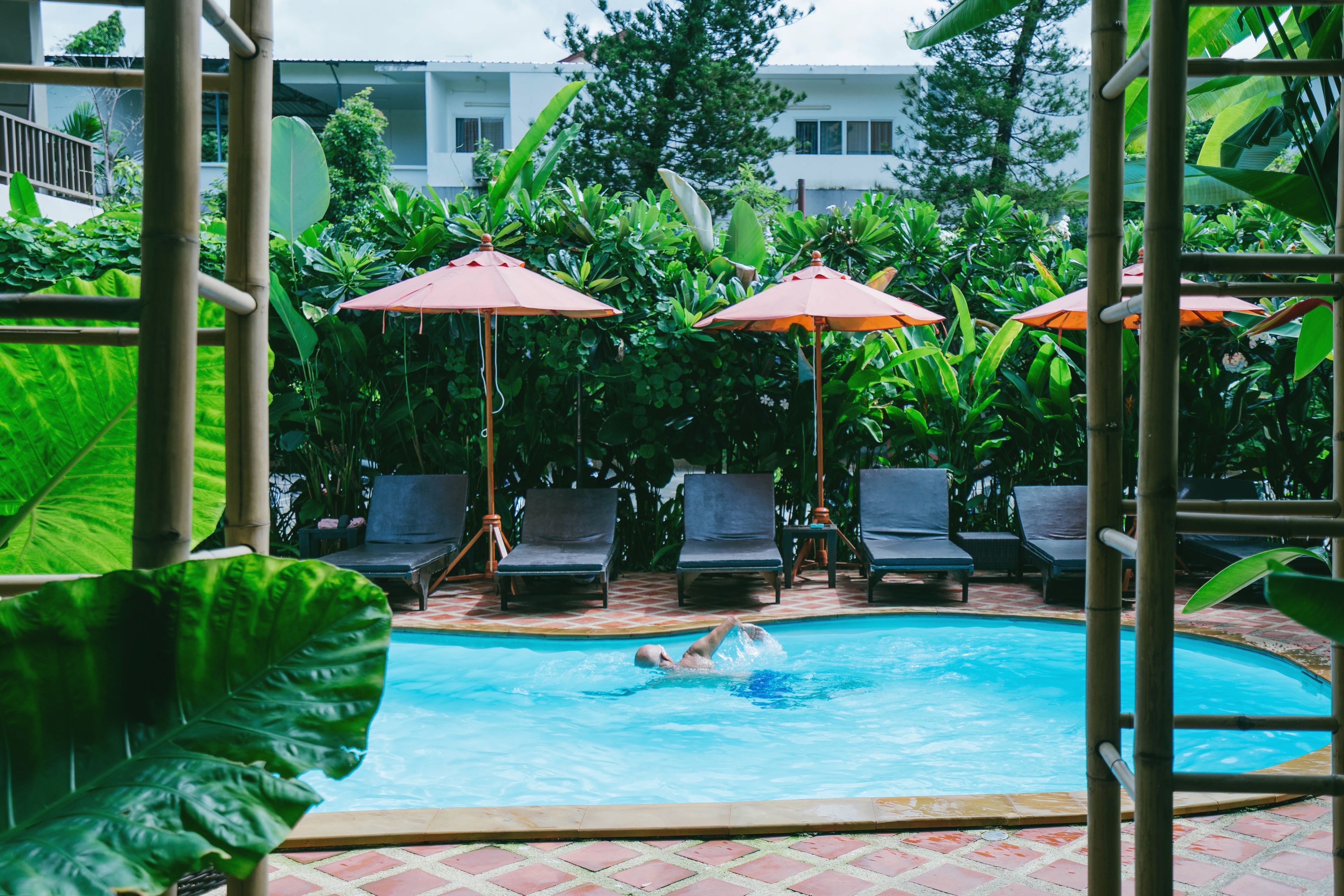 outdoor pool, open 8 am to 10 pm, pool umbrellas, pool loungers