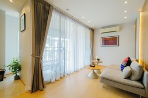 Suite, 2 Bedrooms | Living area | LED TV, DVD player - The Opium Chiang Mai (Chiang Mai)