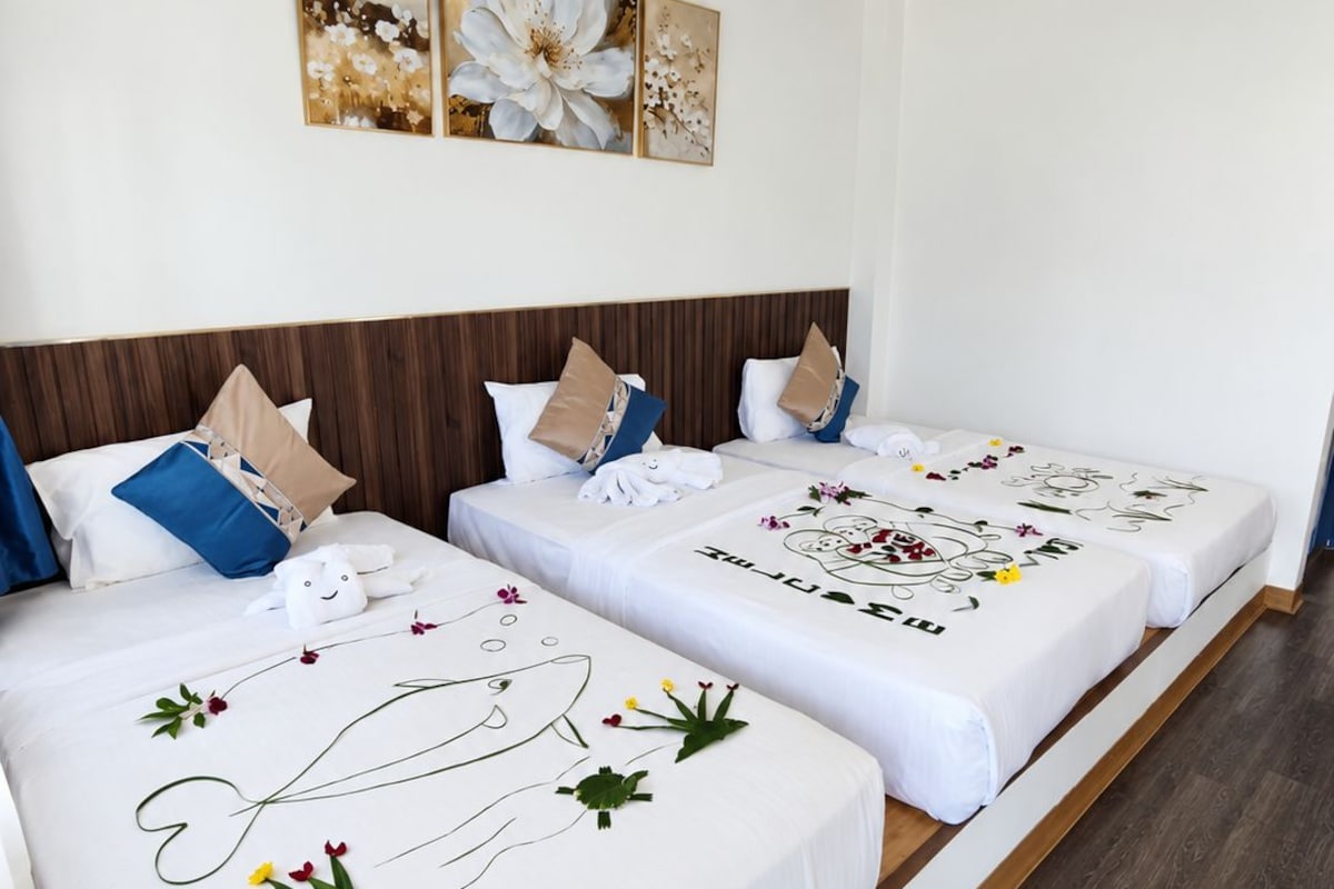Basic Triple Room, Multiple Beds, Garden View | Minibar, free WiFi, bed sheets
