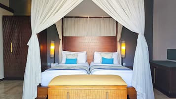 A double bed with a canopy, two bedside tables, and a headboard with a geometric pattern.
