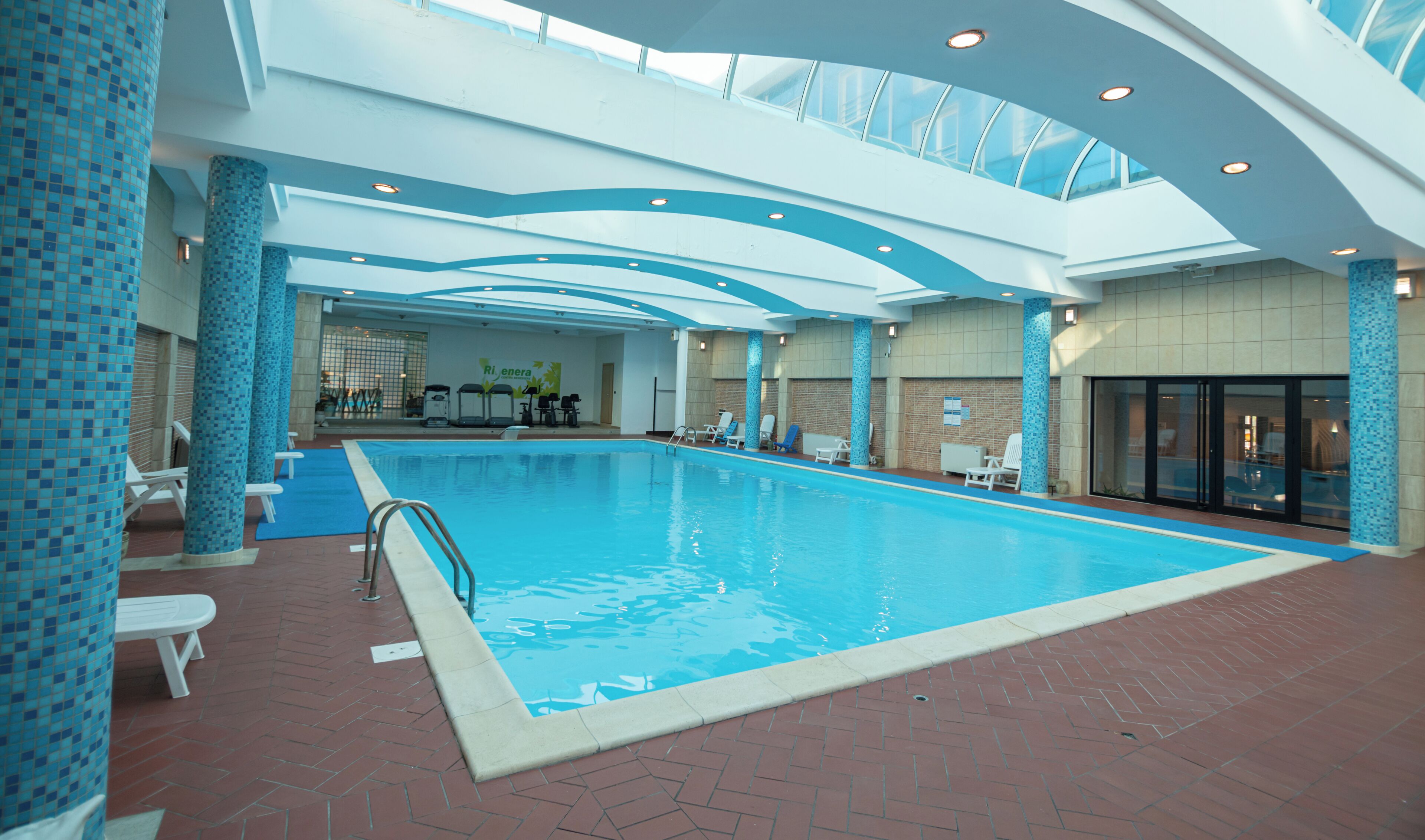 Indoor pool, open 8:00 AM to 10:00 PM, pool umbrellas, sun loungers