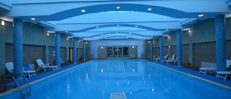 Indoor pool, open 8:00 AM to 10:00 PM, pool umbrellas, sun loungers