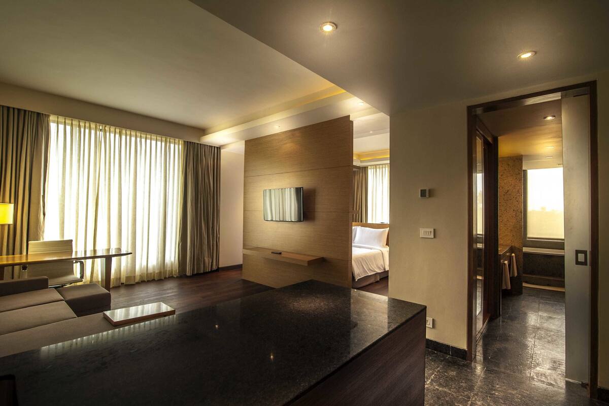 suite, 1 king bed with sofa bed | living area | 40-inch lcd tv with satellite channels, tv