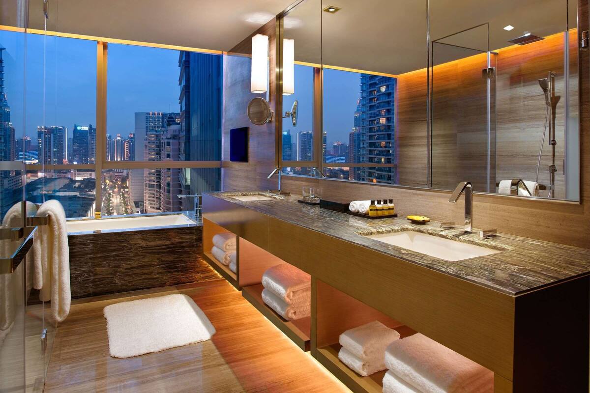 separate bathtub and shower, hair dryer, bathrobes, bidet