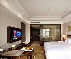 Habitación ejecutiva, 1 cama King size, piso ejecutivo | Minibar, caja de seguridad en la habitación, cunas y ropa de cama