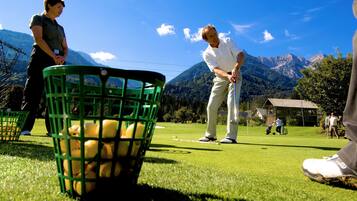 Golfers can enjoy a round on the well-manicured course with breathtaking mountain views.