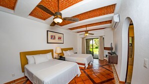 A hotel room with two beds, a ceiling fan, a framed artwork, and a view of the outdoors. - Hotel Villa Mexicana Golf Resort (Corregidora)