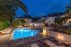 Seasonal outdoor pool, open 9:30 AM to 8:00 PM, pool umbrellas