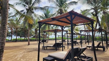 On the beach, free beach shuttle, free beach cabanas, sun loungers