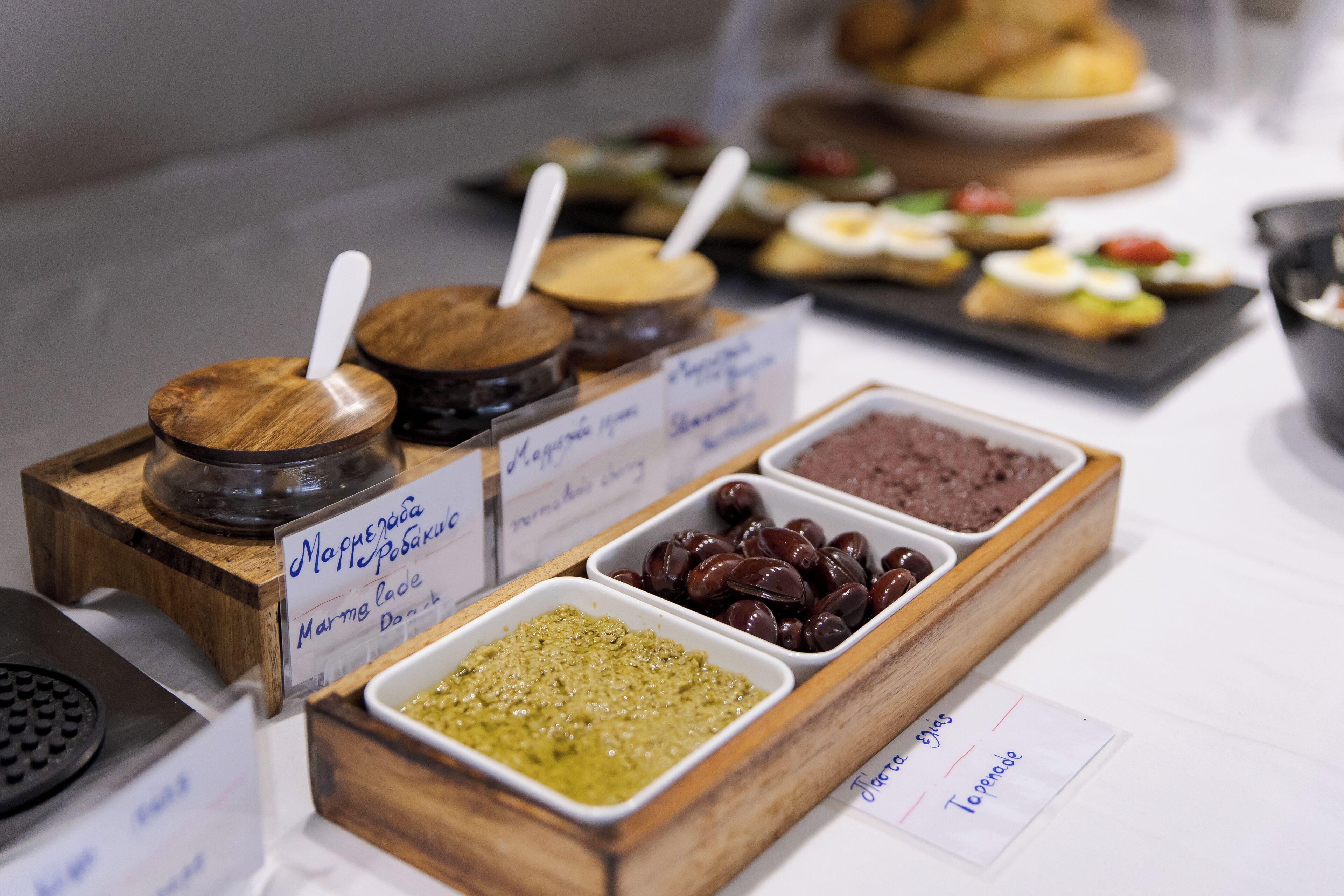 A buffet with various food items and condiments.