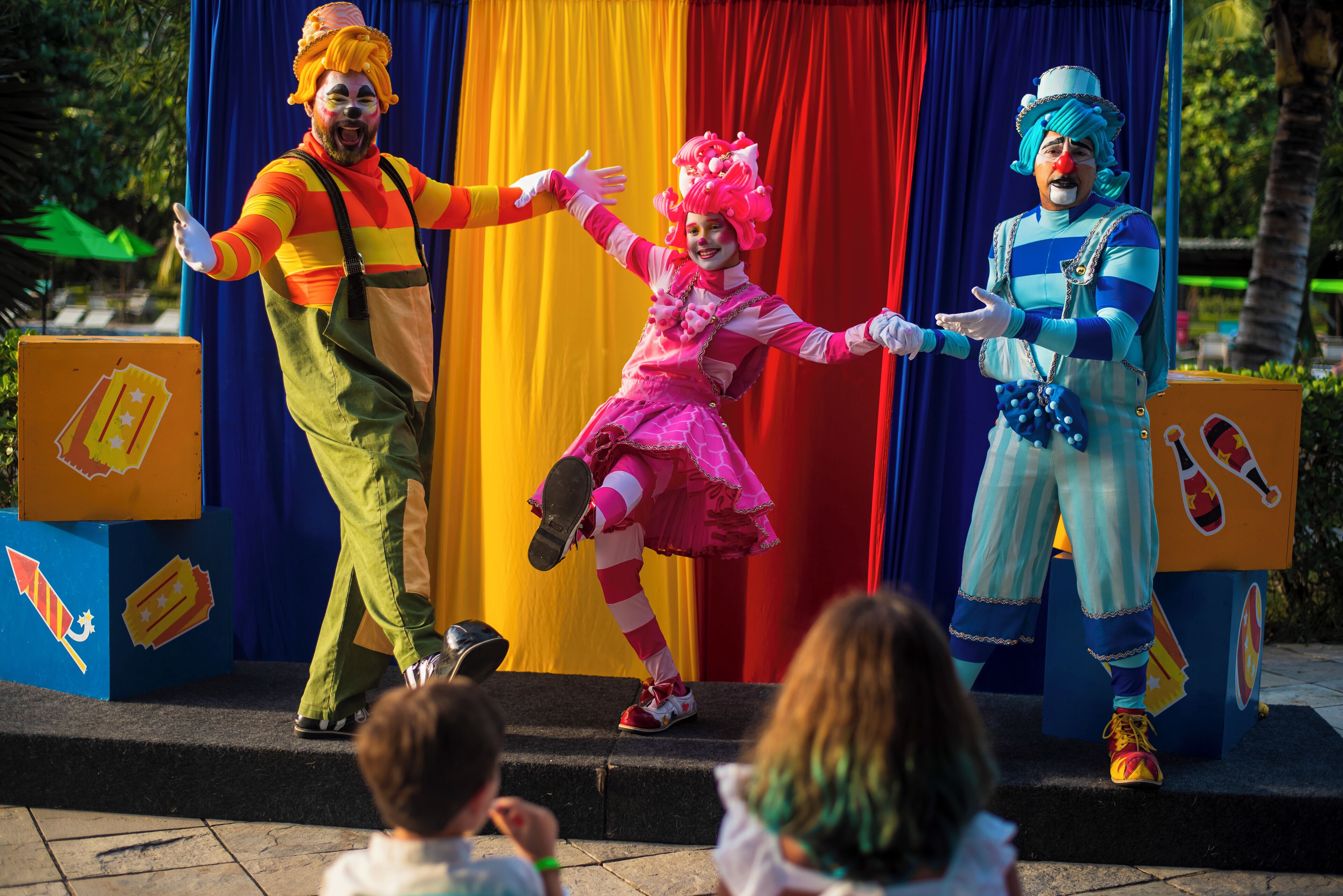 A stage with performers in colorful costumes.