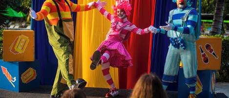 A stage with performers in colorful costumes.