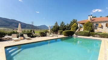 Outdoor pool, open 8:00 AM to 8:00 PM, pool umbrellas, sun loungers
