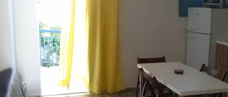 Standard Apartment, Sea View | Private kitchen | Oven, stovetop, coffee/tea maker, cookware/dishes/utensils