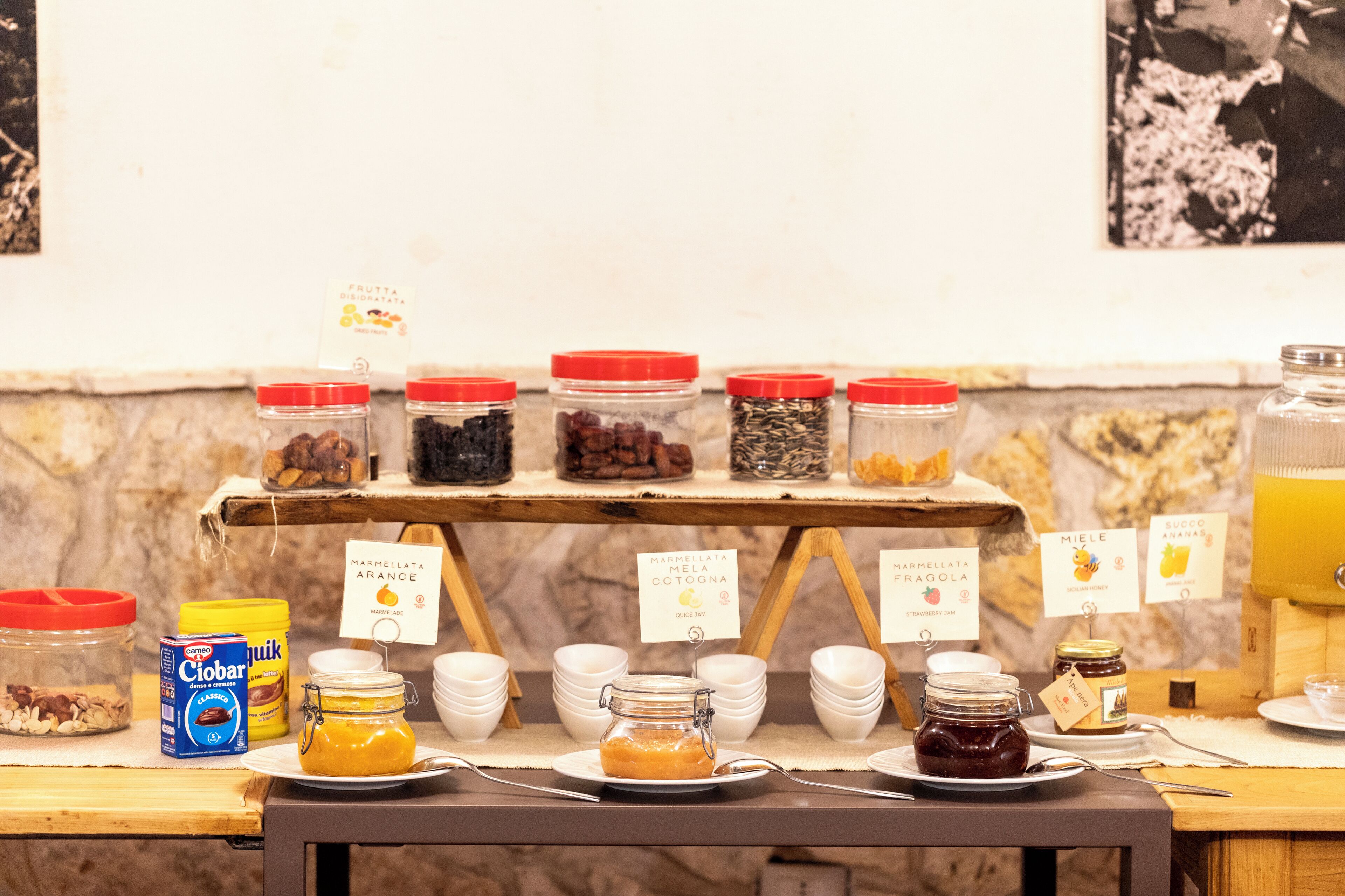 A breakfast buffet with various food items and condiments.