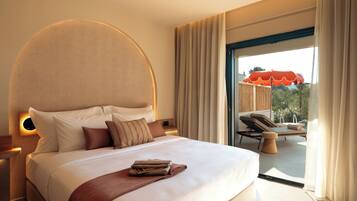 Secret Garden Pool Suite | Minibar, desk, blackout curtains, iron/ironing board