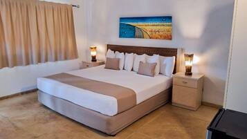 Habitación Confort | Ropa de cama de alta calidad y caja de seguridad en la habitación
