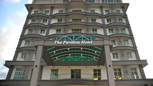 A multi-story hotel with a prominent sign reading "The Pavilion Hotel." - The Pavilion Hotel (Sandakan)