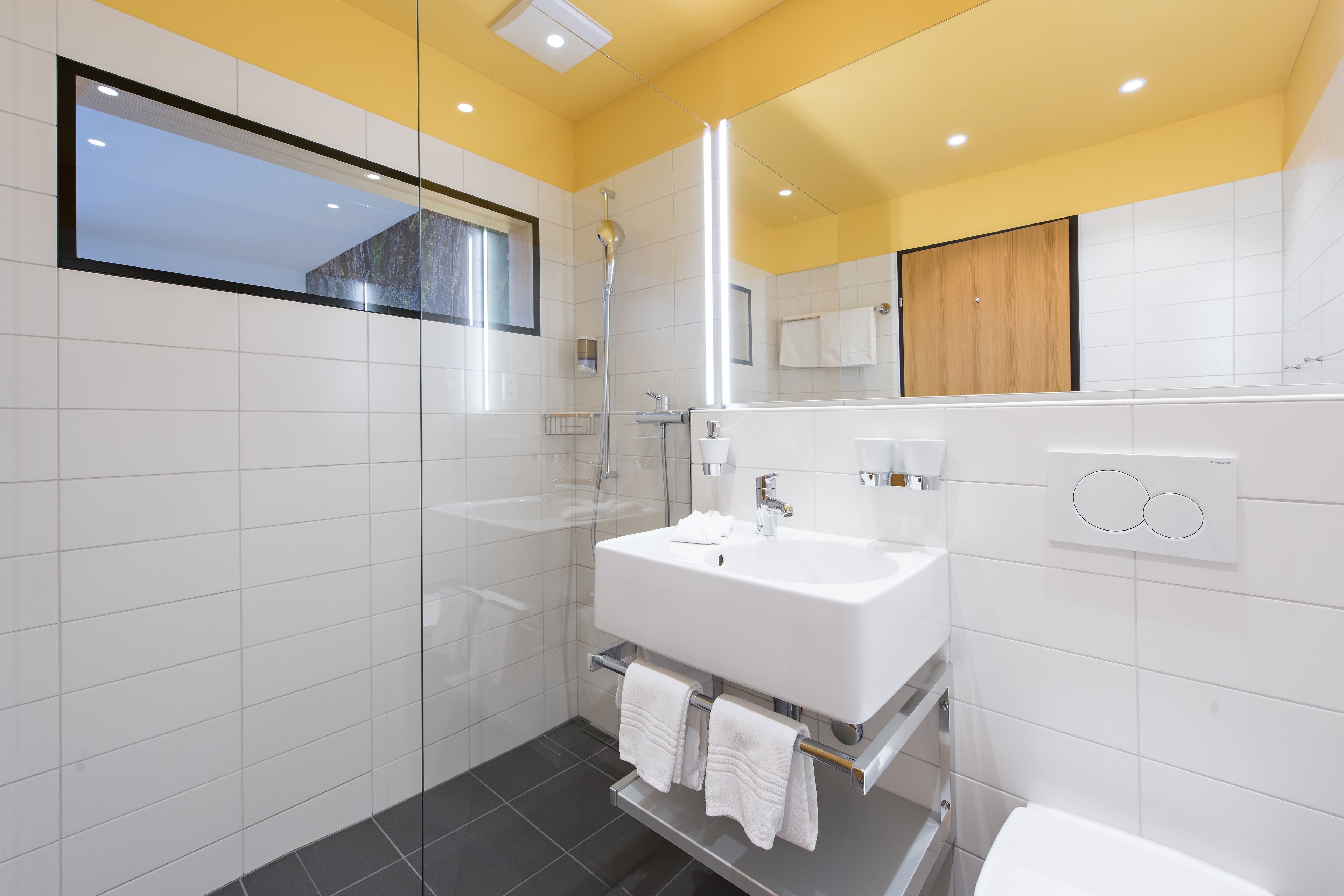 separate bathtub and shower, hair dryer, towels