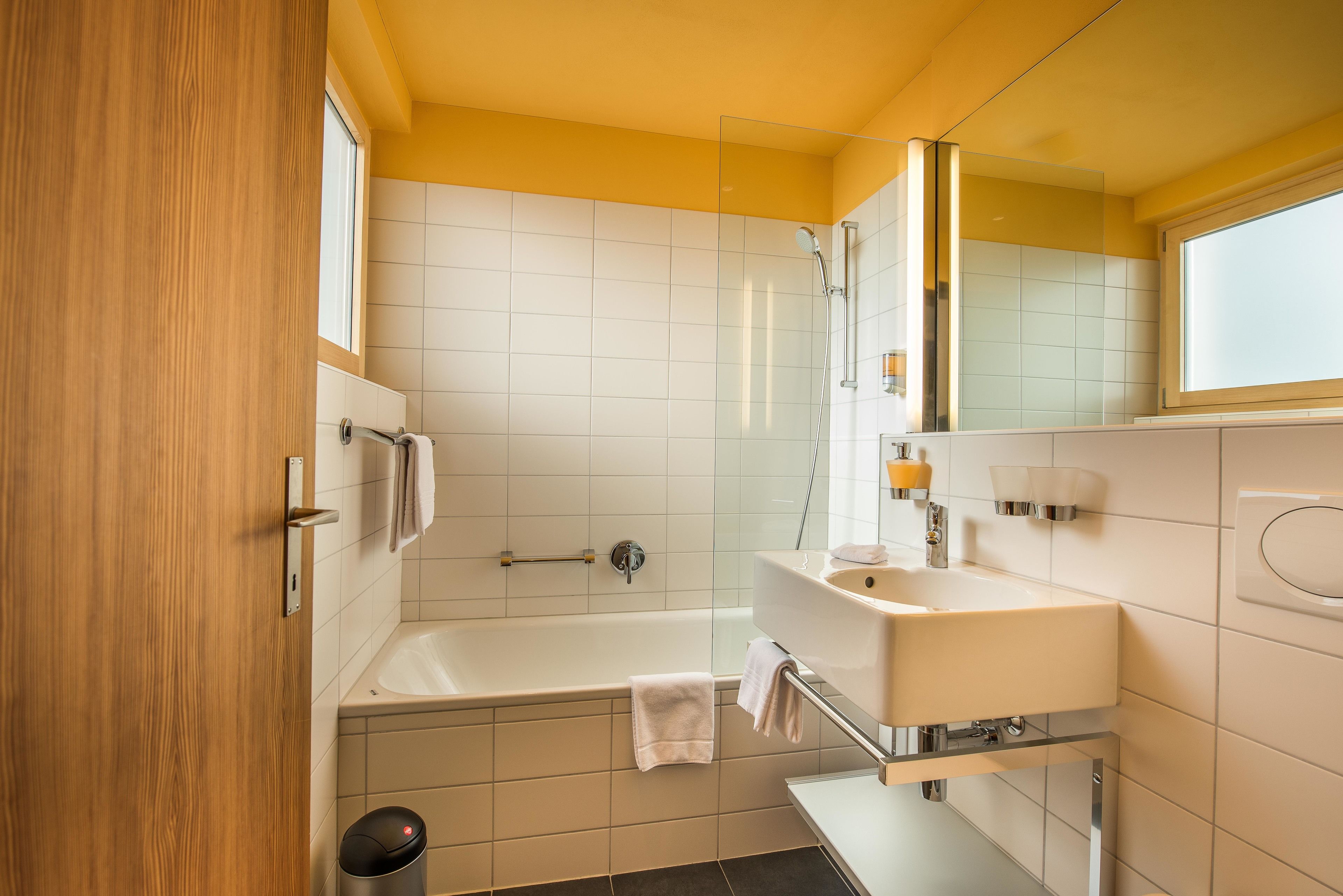 economy double room | bathroom | separate bathtub and shower, hair dryer, towels