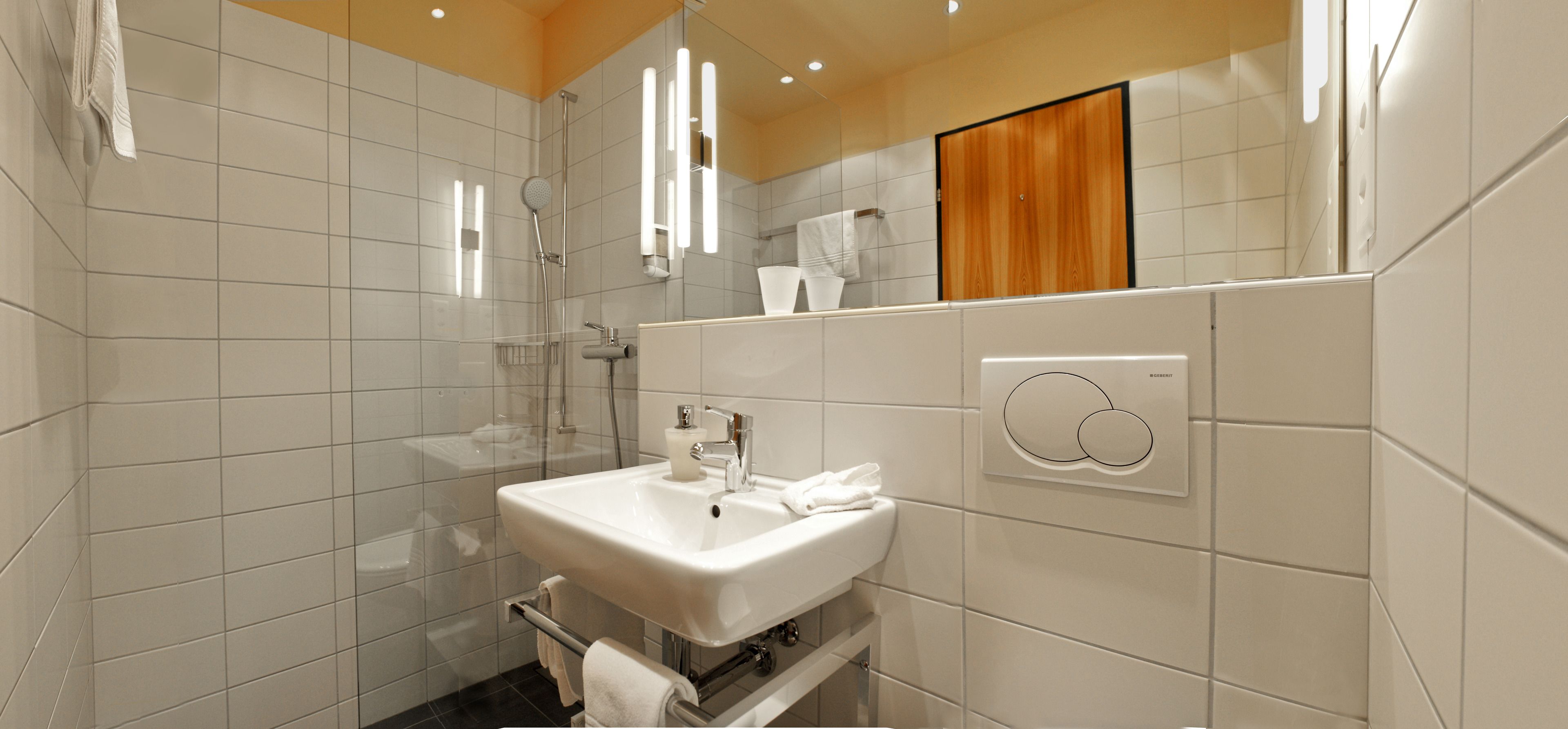 comfort single room | bathroom | separate bathtub and shower, hair dryer, towels