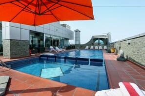 Outdoor pool, pool umbrellas, pool loungers
