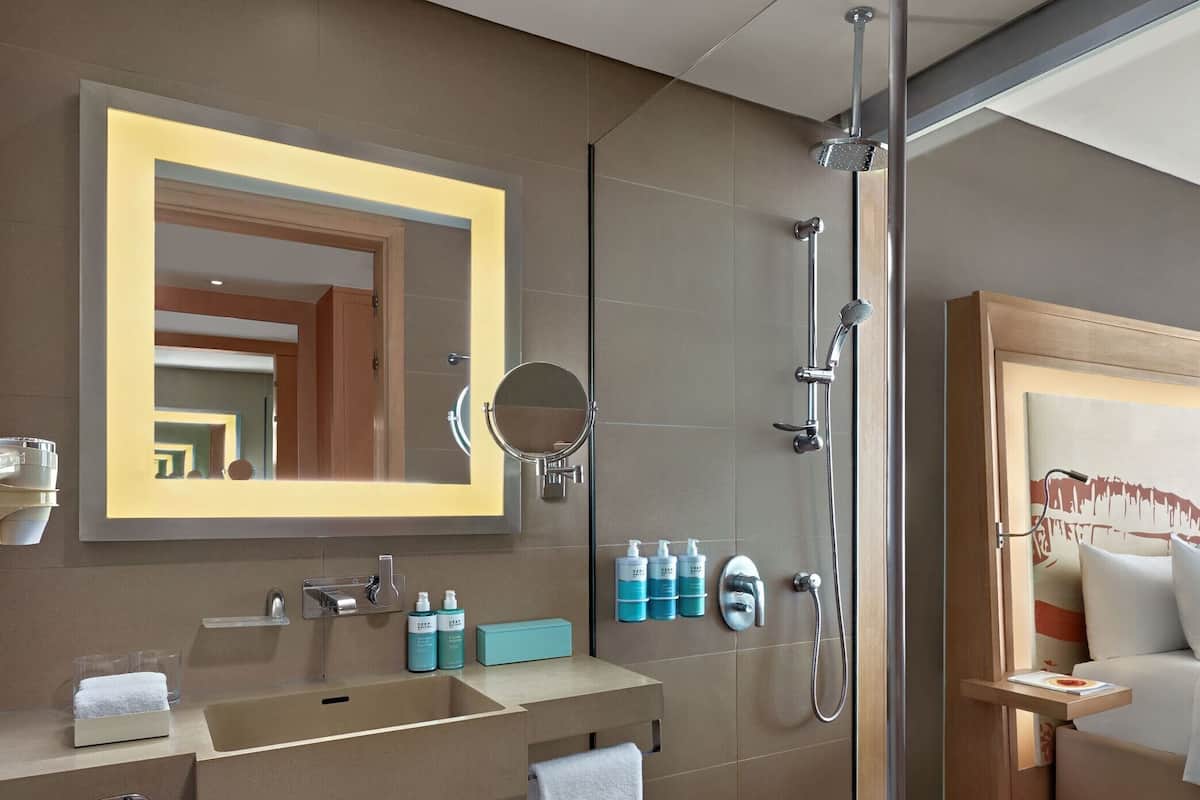 Studio, 1 King Bed, Balcony, River View (Full Kitchen) | Bathroom | Rainfall showerhead, eco-friendly toiletries, hair dryer, slippers