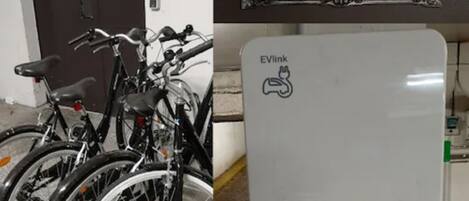 A bicycle parking area with a sign indicating EVlink charging availability.