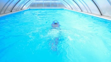 Indoor pool, outdoor pool, pool umbrellas