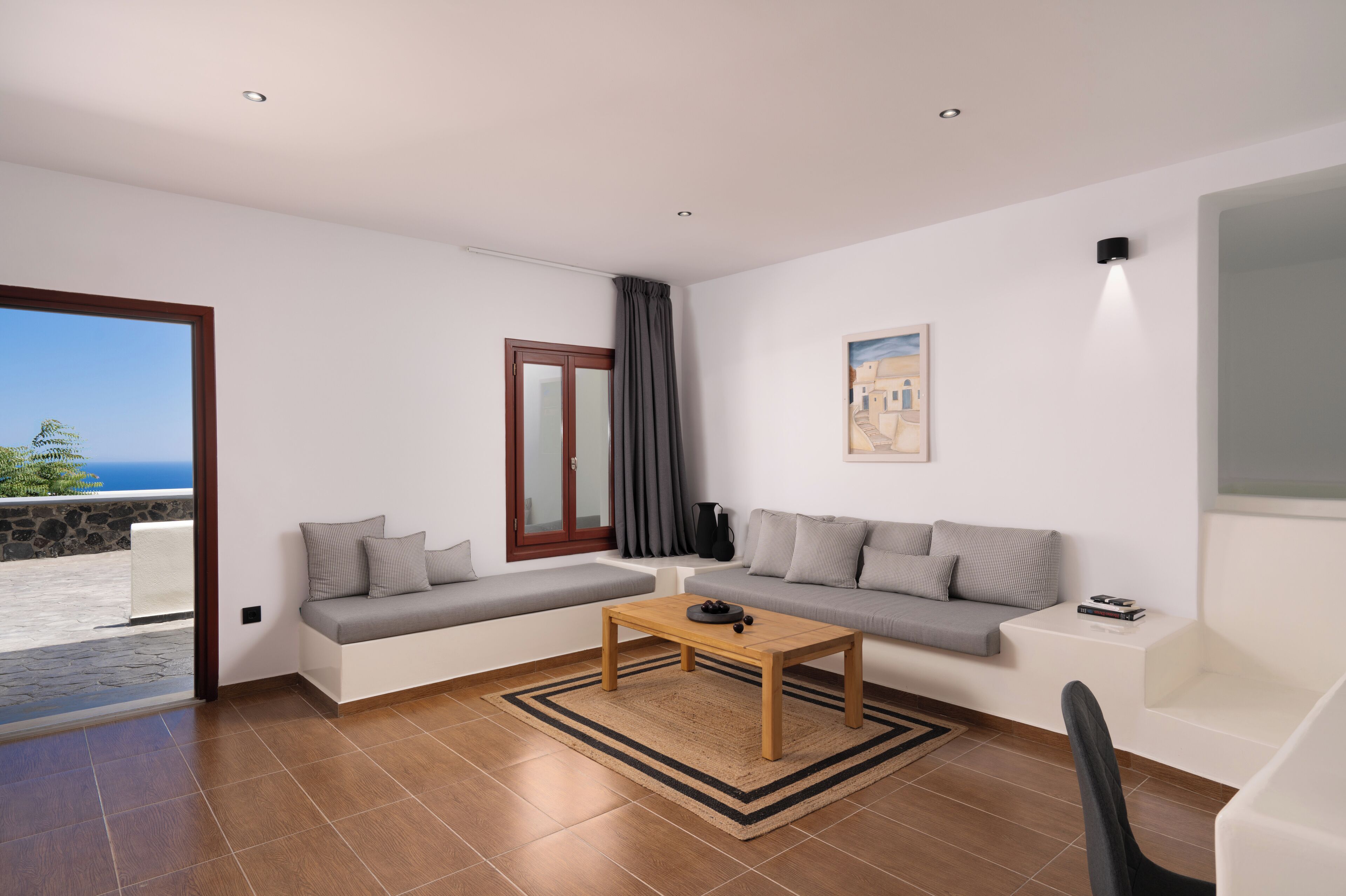 deluxe suite | living area | 32-inch lcd tv with satellite channels, tv, offices