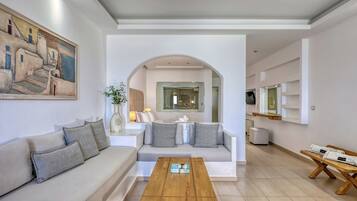 Jacuzzi Premium Suite with Indoor Hottub | Living area | 32-inch LCD TV with satellite channels, TV, offices