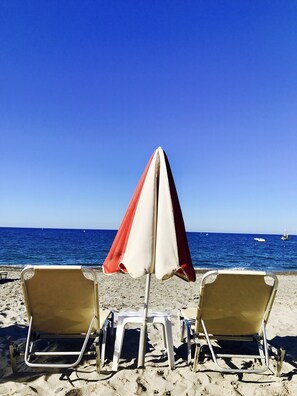 On the beach, sun loungers, beach umbrellas, 2 beach bars