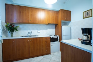 Departamento, 1 habitación | Cocina privada | Refrigerador con congelador, horno y parrilla de estufa