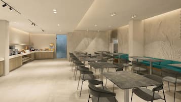 A modern cafe with a counter, seating area, and decorative wall panels.