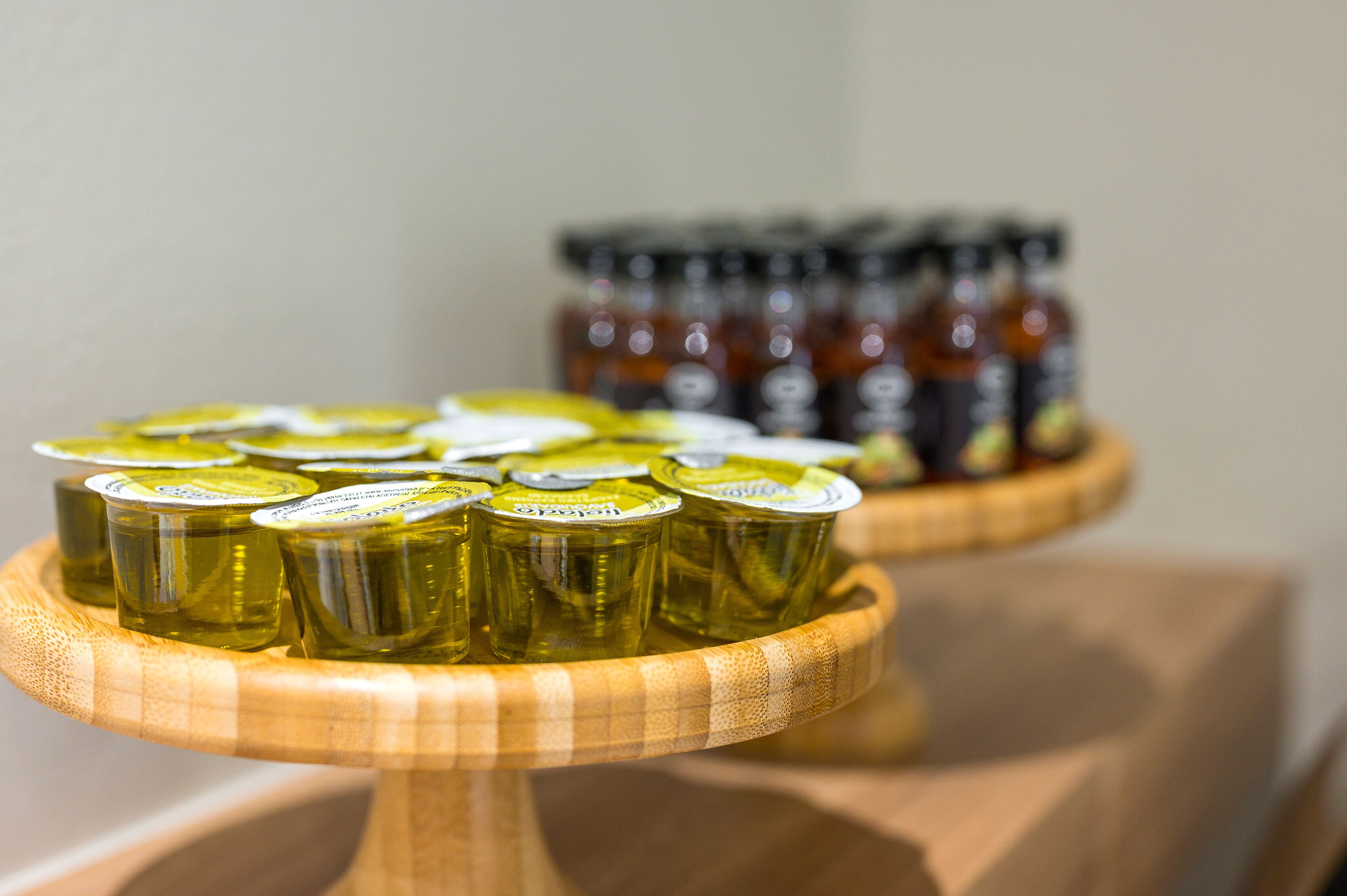 A wooden stand holding several jars of pickles.