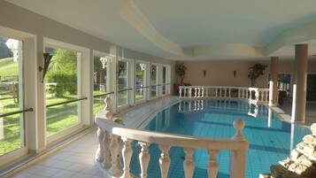 Indoor pool, seasonal outdoor pool, pool umbrellas, pool loungers