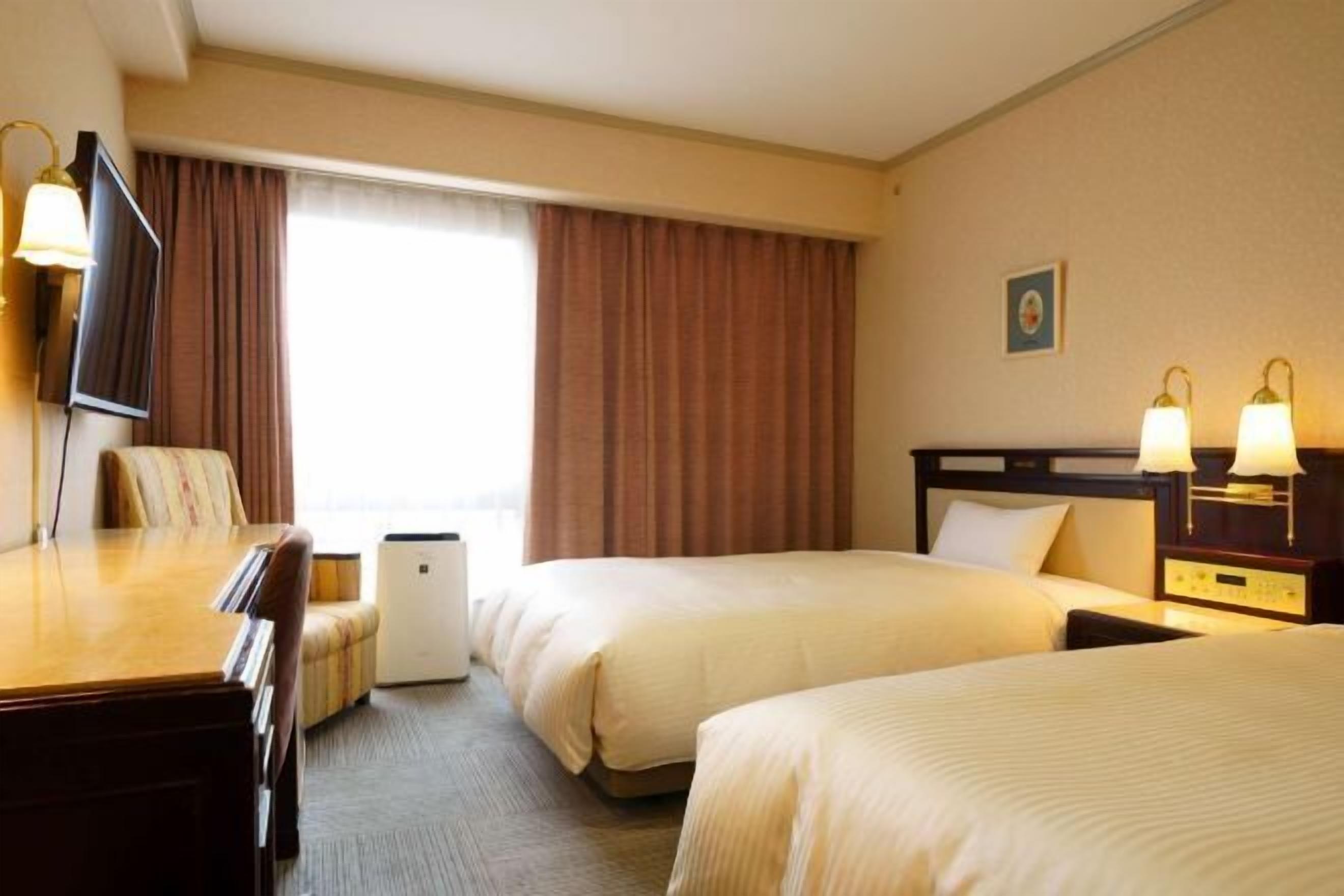 Down comforters, desk, laptop workspace, blackout drapes