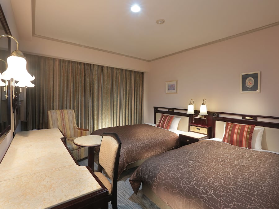 Down duvets, desk, laptop workspace, blackout curtains