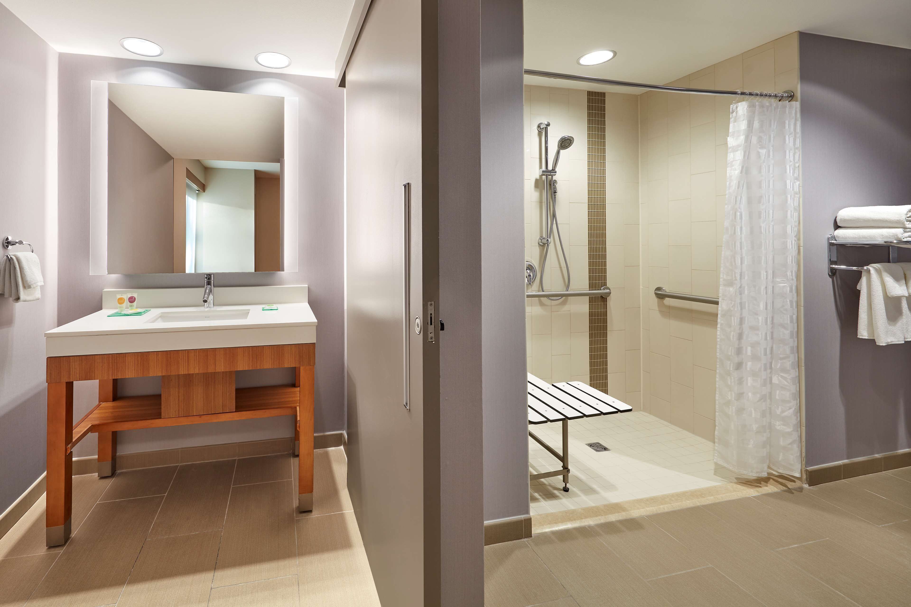 designer toiletries, hair dryer, towels, soap