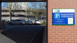 A private car park for hotel guests with a sign indicating it is full use of U-park car park next door. - Holiday Inn Express Harlow by IHG (Harlow)
