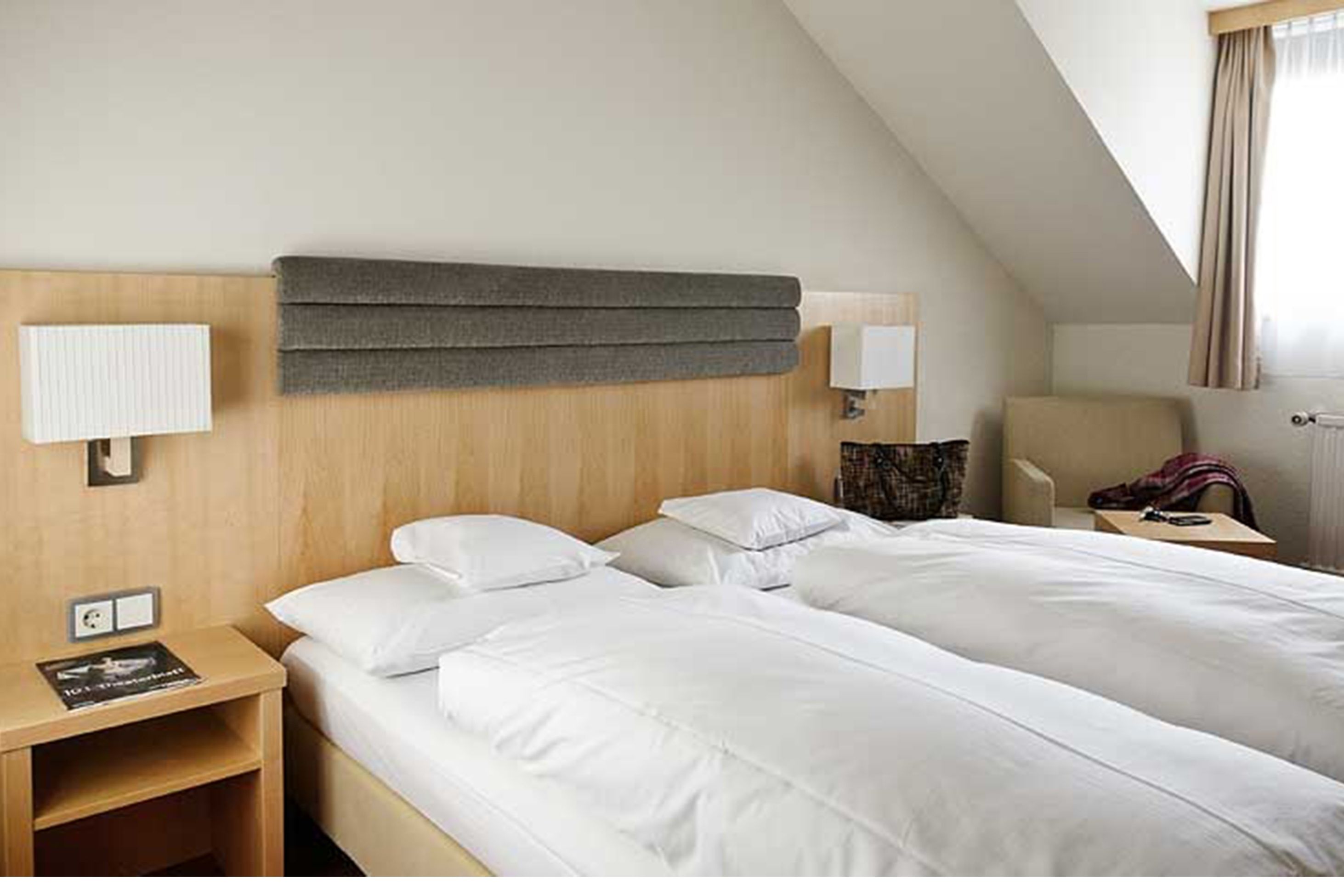 hypo-allergenic bedding, down duvets, minibar, in-room safe