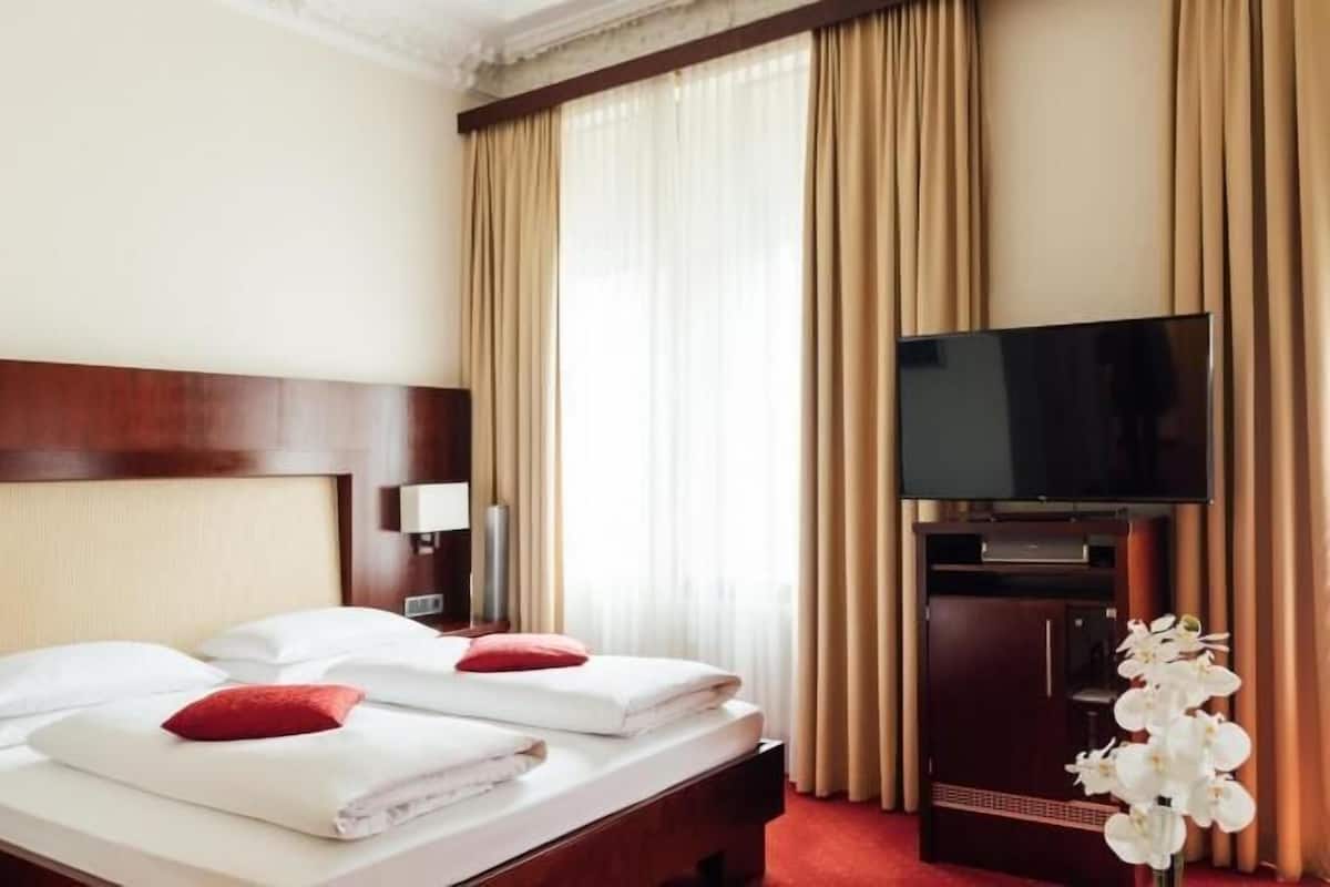 Hypo-allergenic bedding, down duvets, minibar, in-room safe